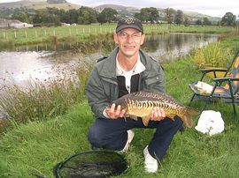 fisherman with carp